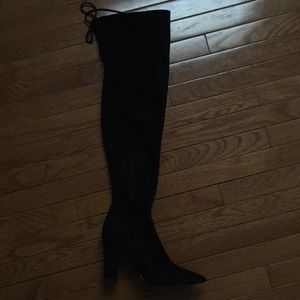 Black heeled thigh high boots